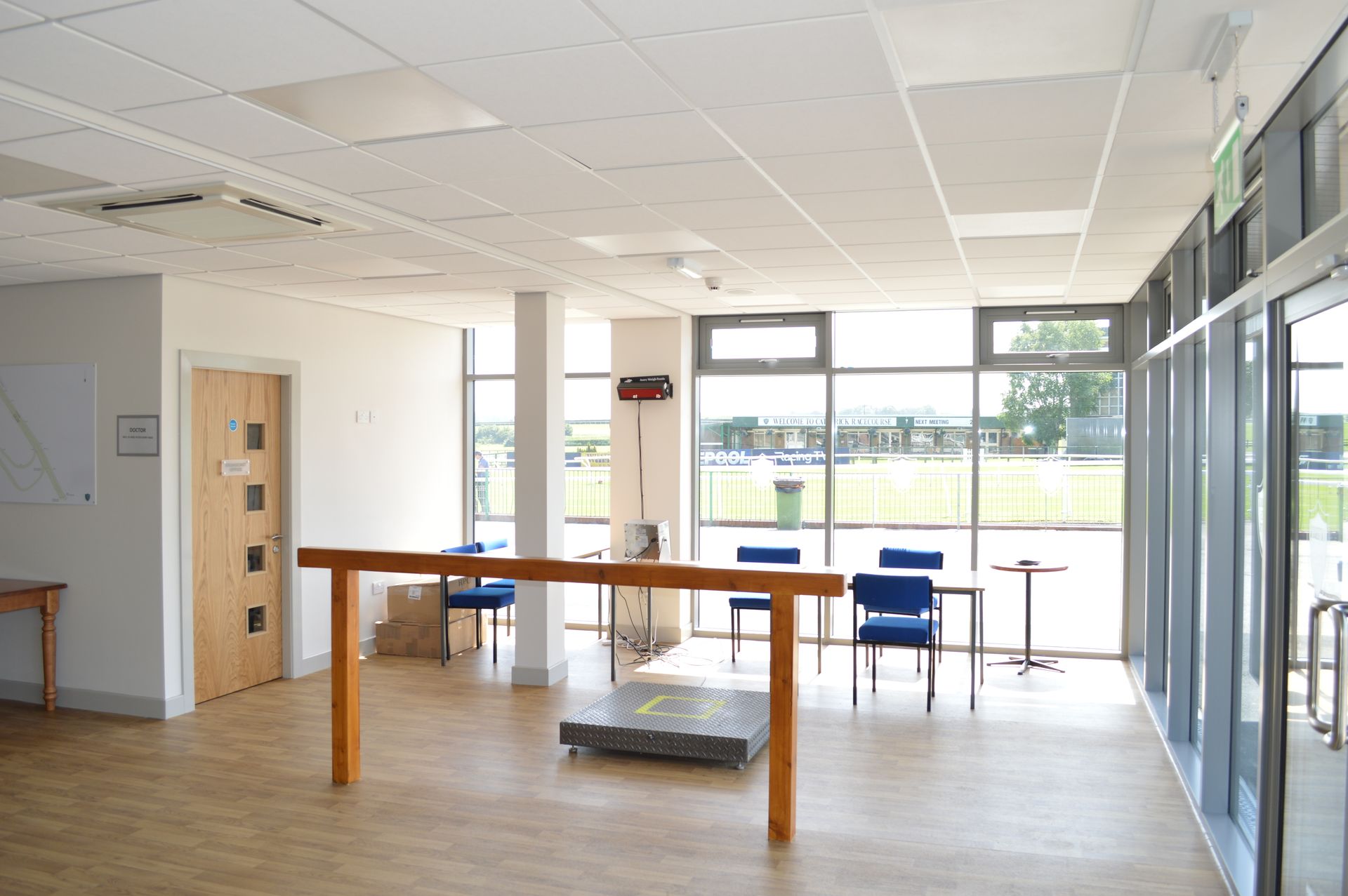 An empty room with a table and chairs in it