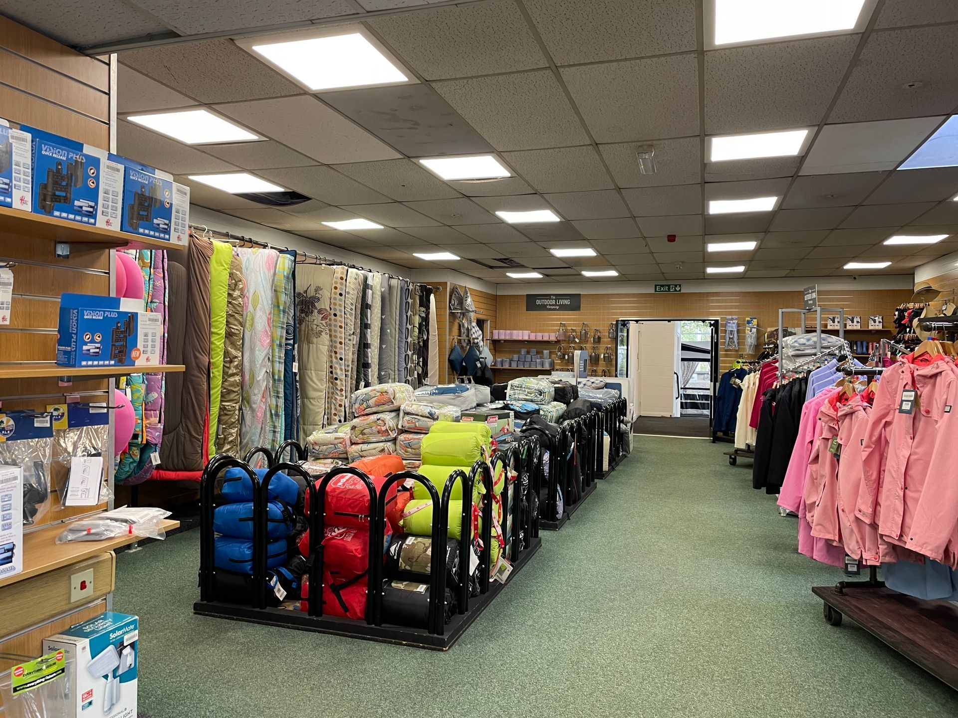 A store filled with lots of clothes and fabrics.