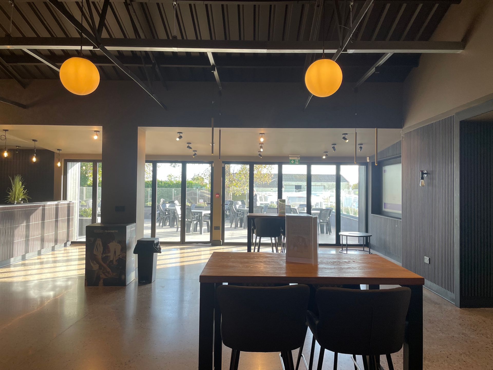 There is a table and chairs in the middle of the room.