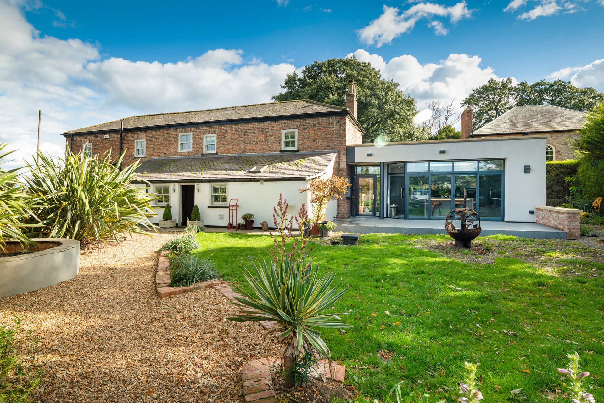 A large house with a large lawn in front of it.