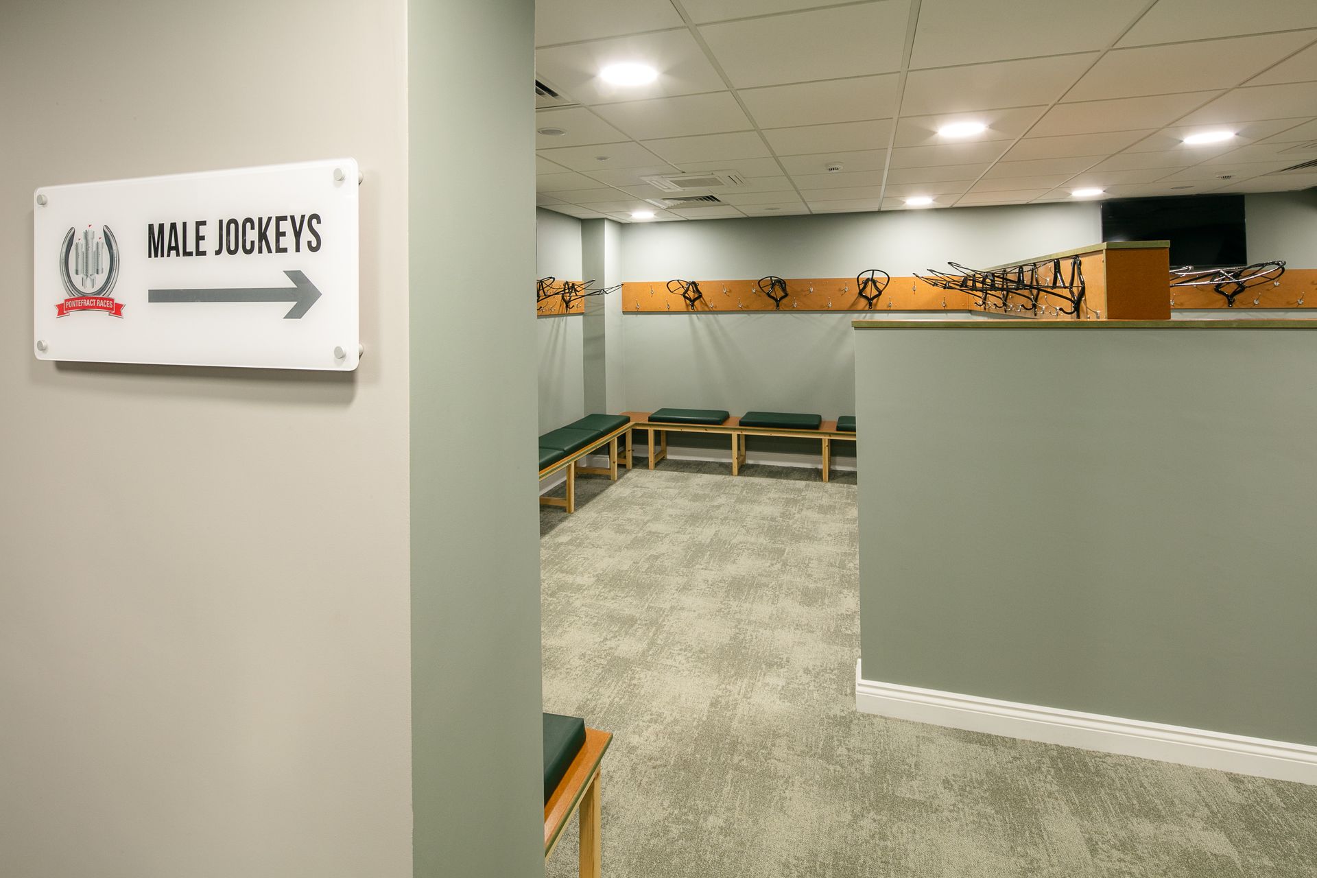 A locker room with a sign that says w.f. jockeys