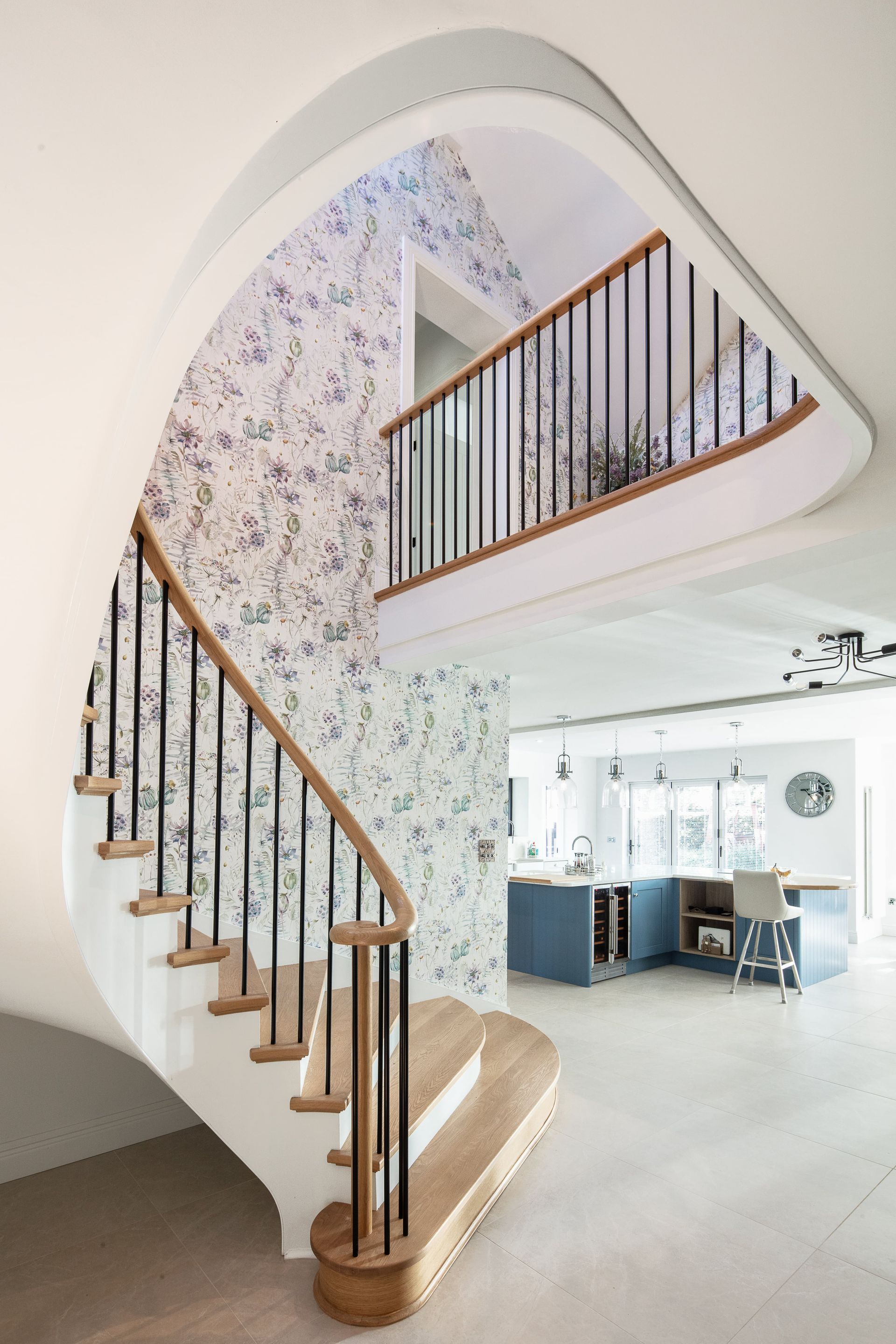 A spiral staircase leading up to the second floor of a house.