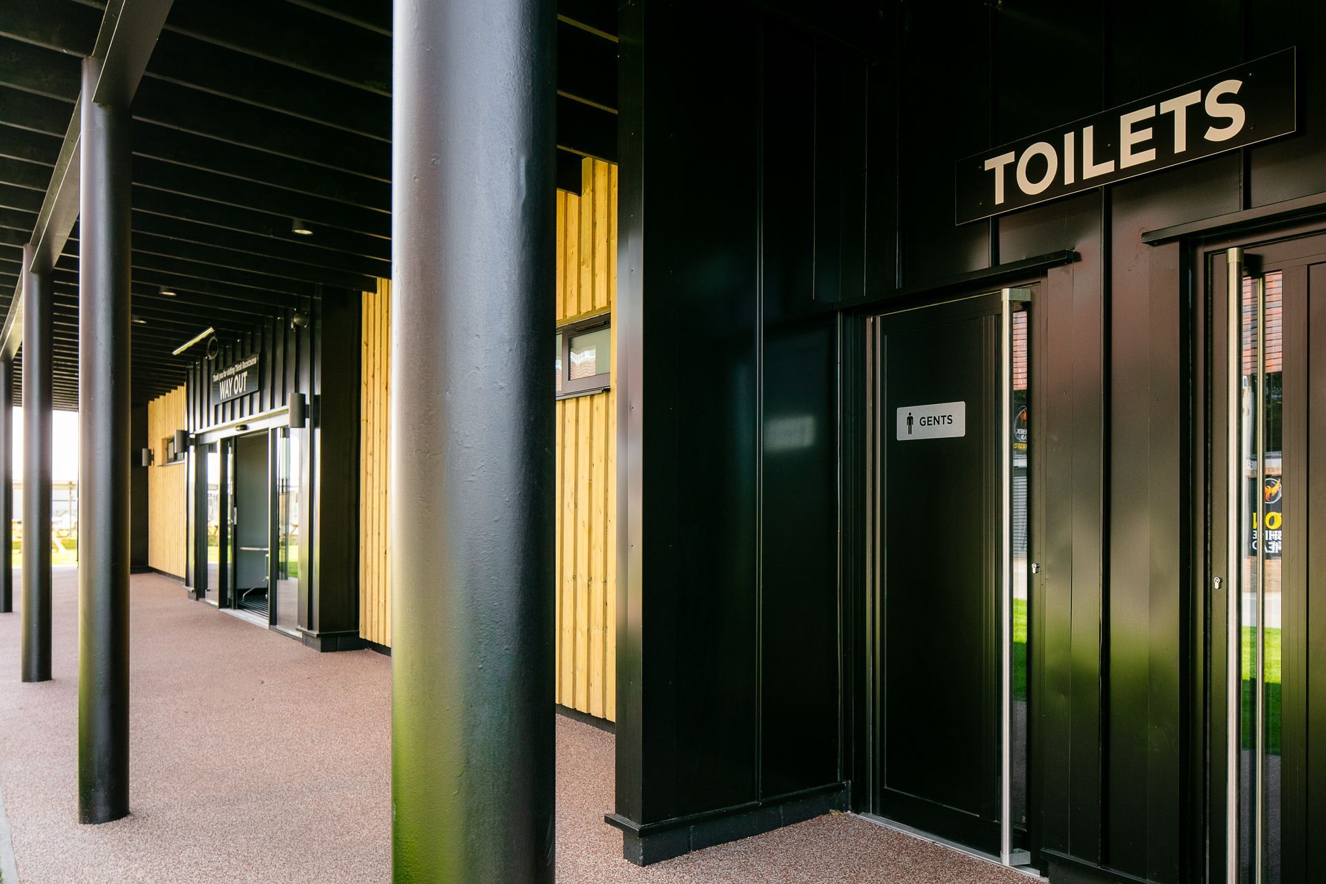 A building with a sign that says toilets on it