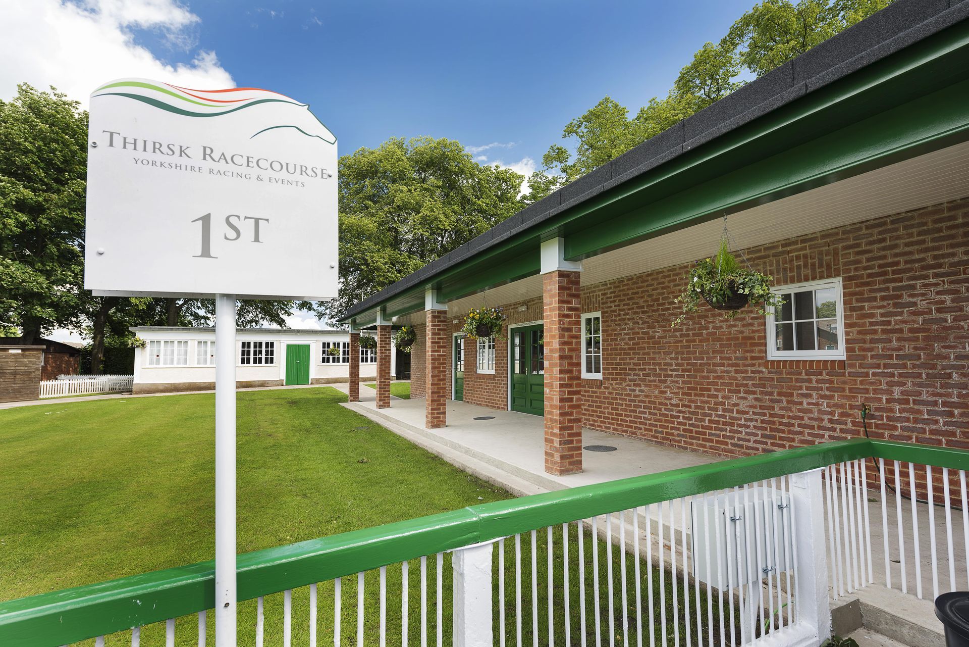 A white sign with the number 1st on it