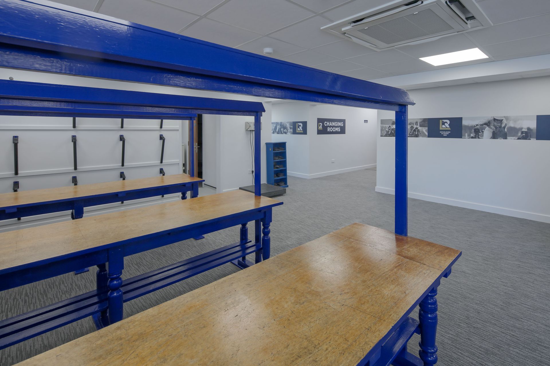 A room with a blue ceiling and a wooden table