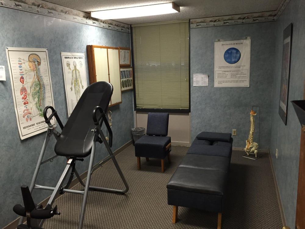 A room with a table and chairs in it