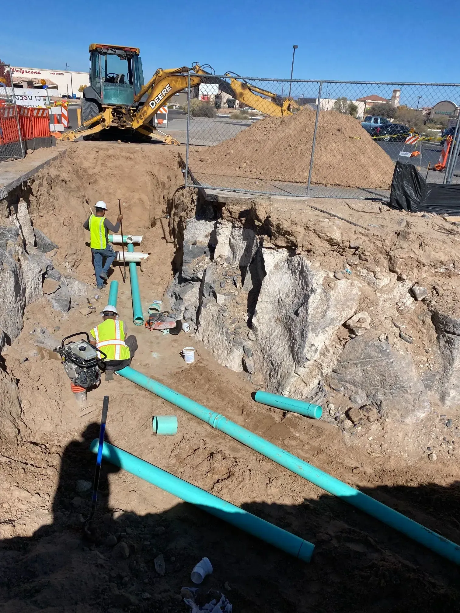 A group of construction workers are working on a construction site.