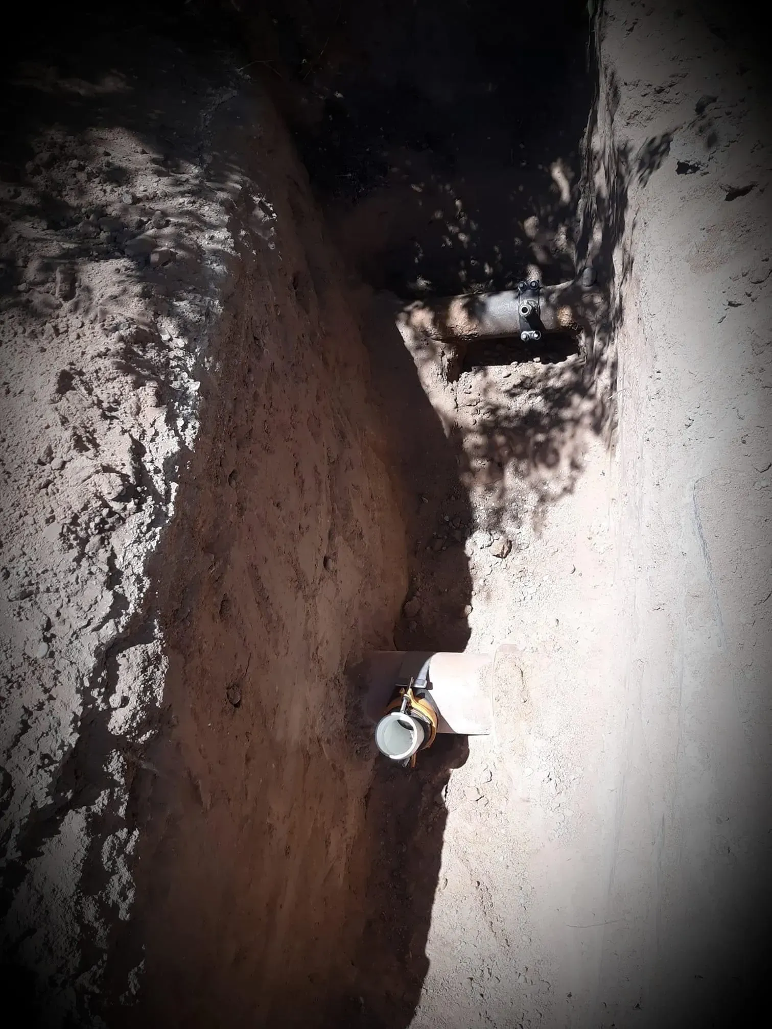 A black and white photo of a person standing in the dirt