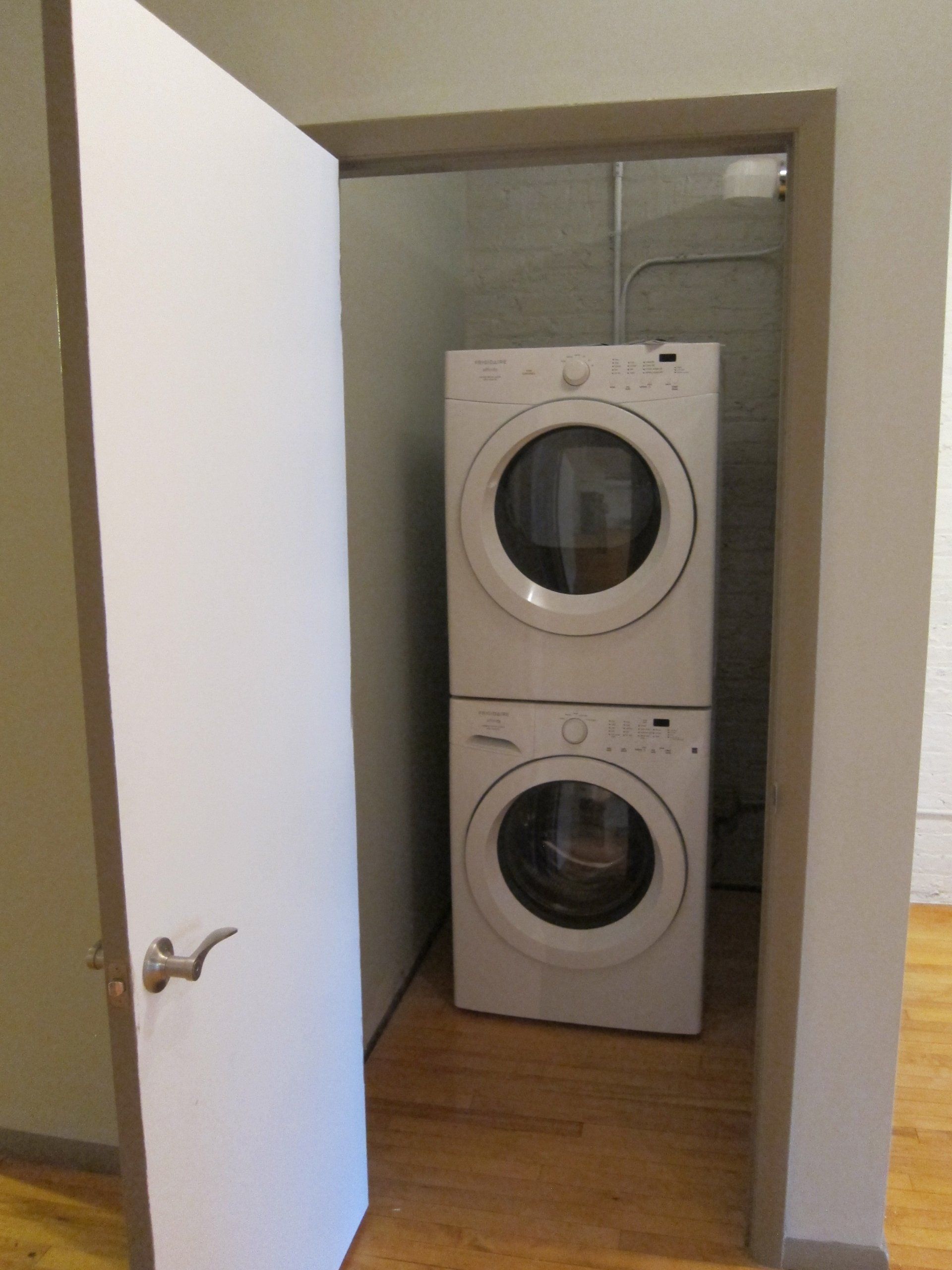 In-unit stacked washer and dryer
