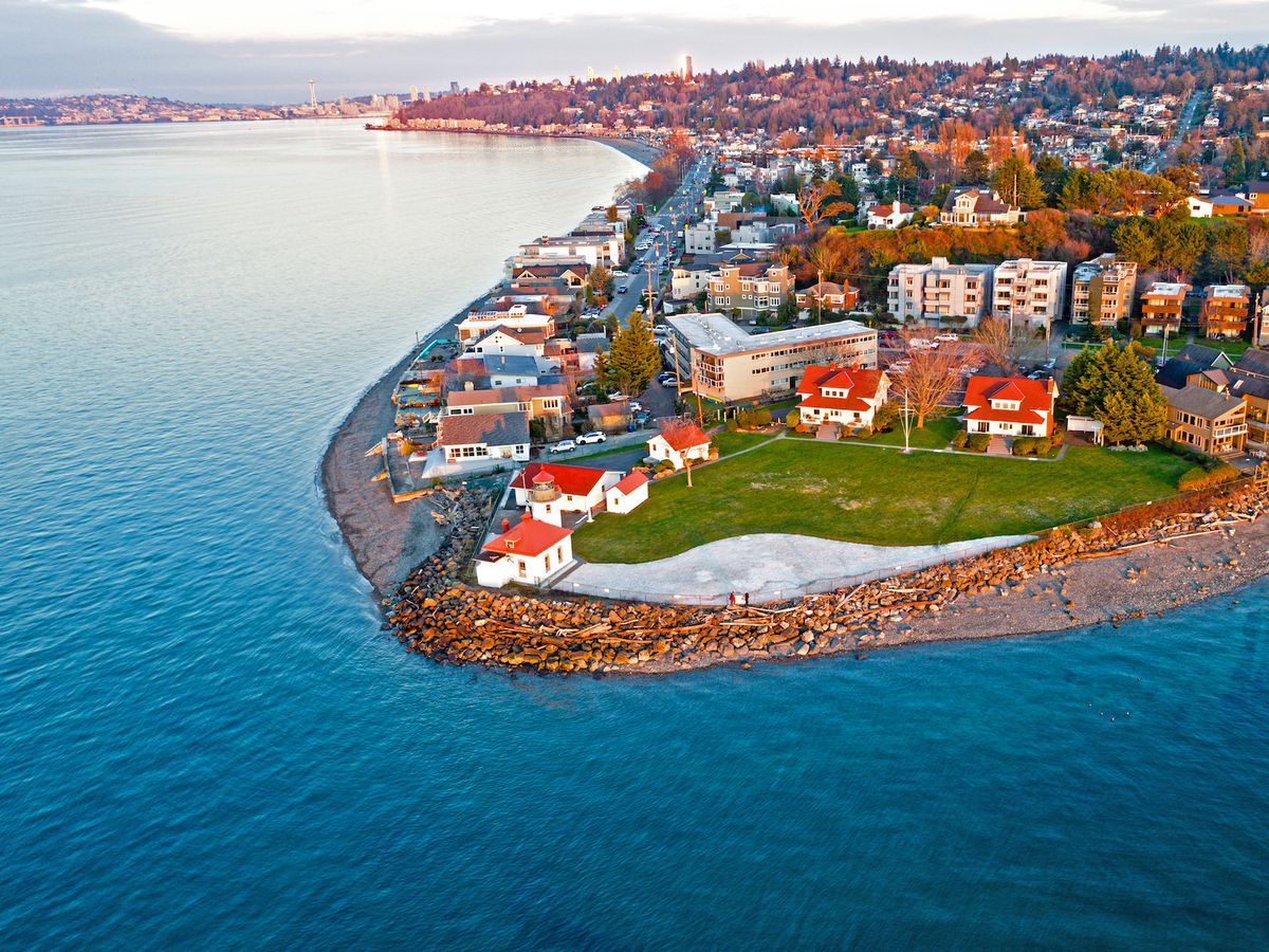 An aerial view of a small island in the middle of a body of water.