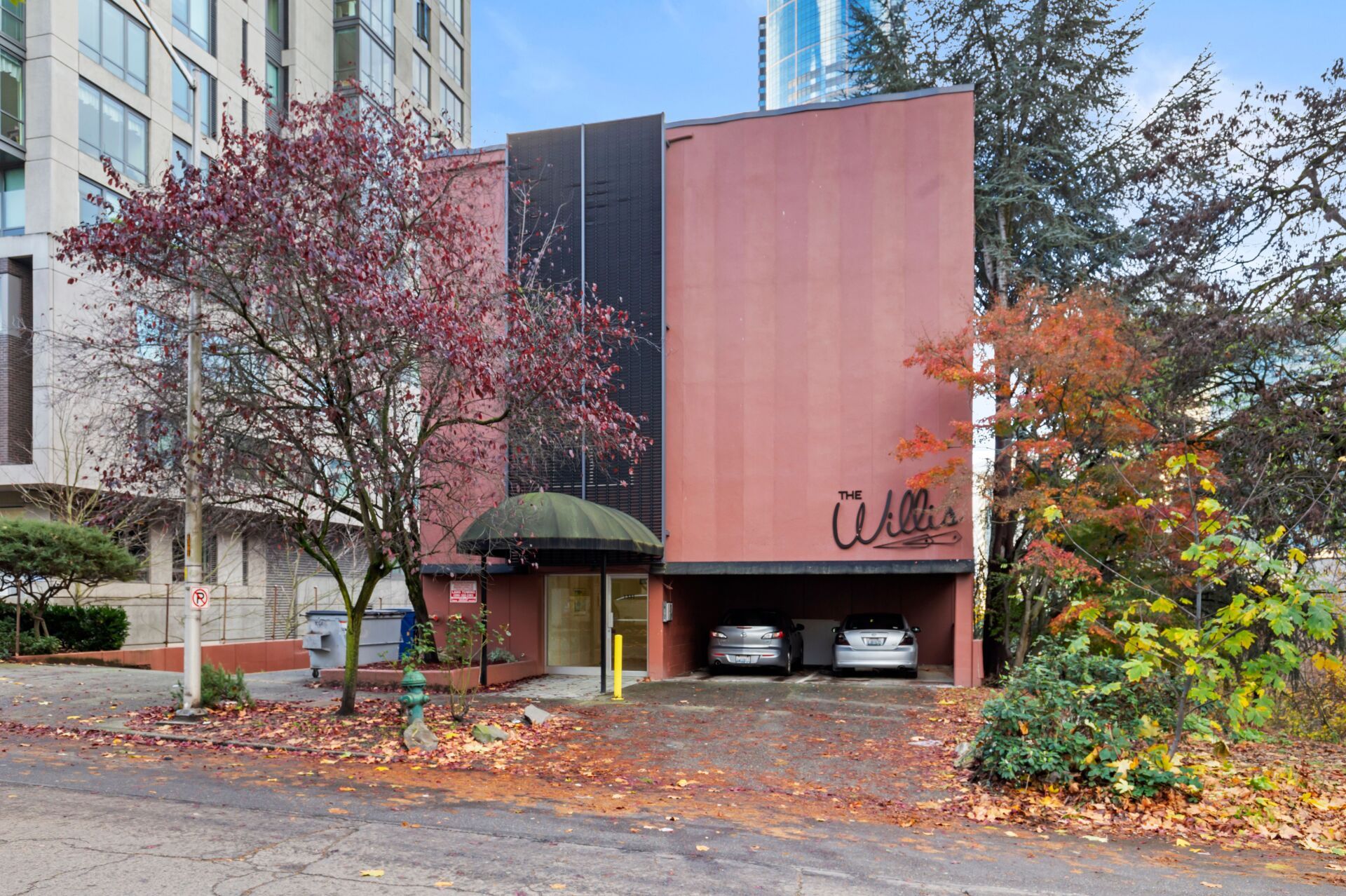 A large building with cars parked in front of it.