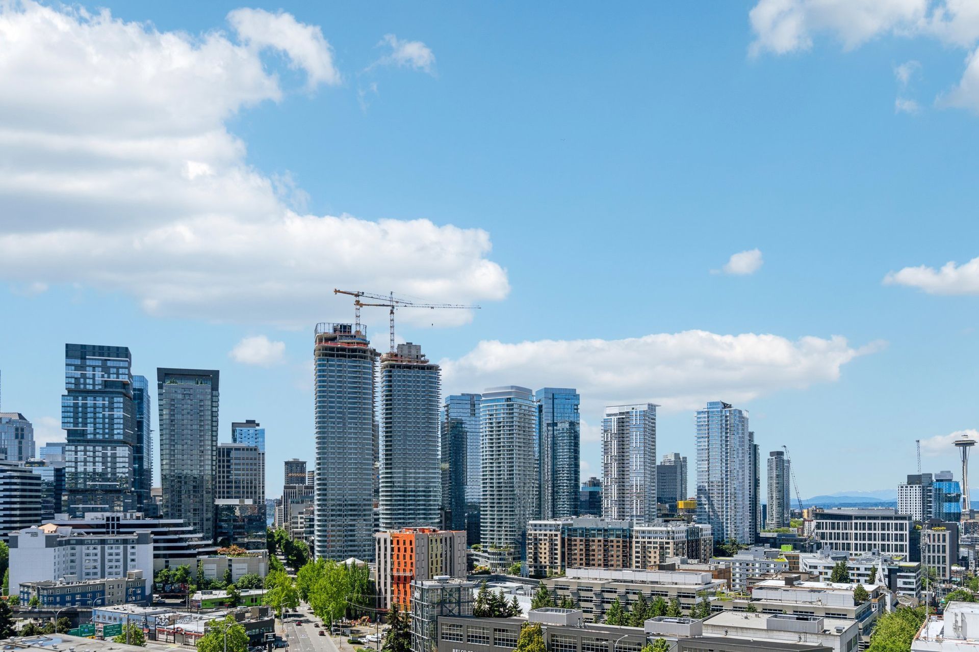 An aerial view of a city skyline on a sunny day.