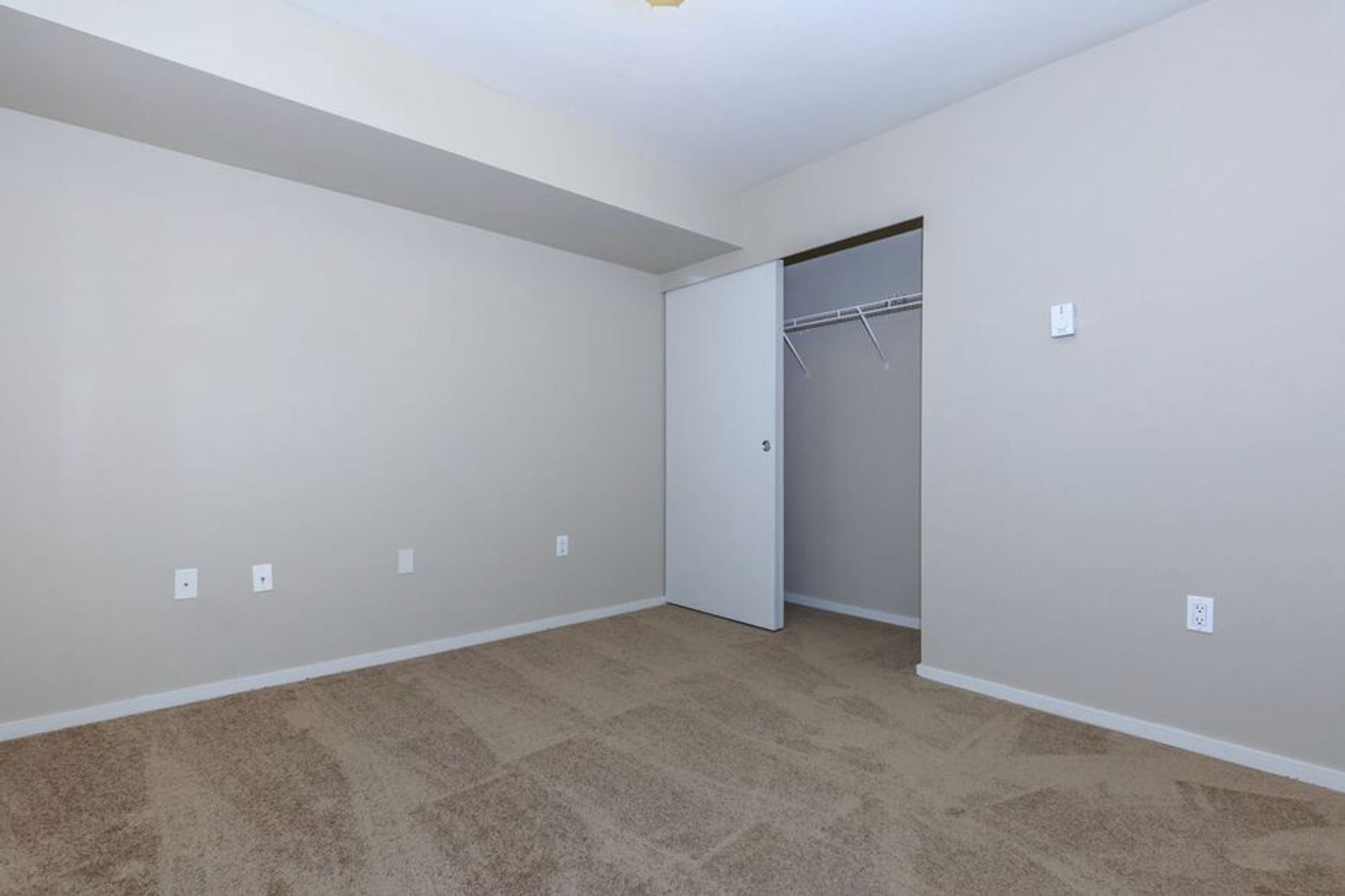 There is a closet in the corner of the room.