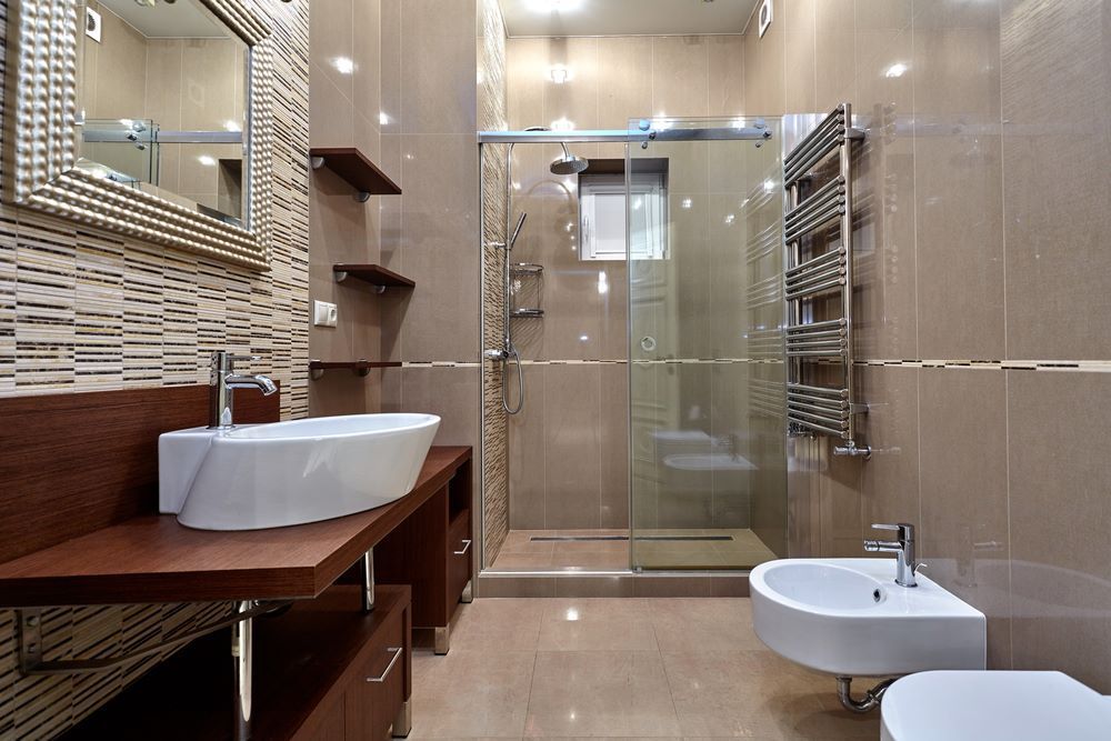 A Bathroom With A Sink, Toilet, And Walk-in Shower — Bananacoast Waterproofing in Korora, NSW