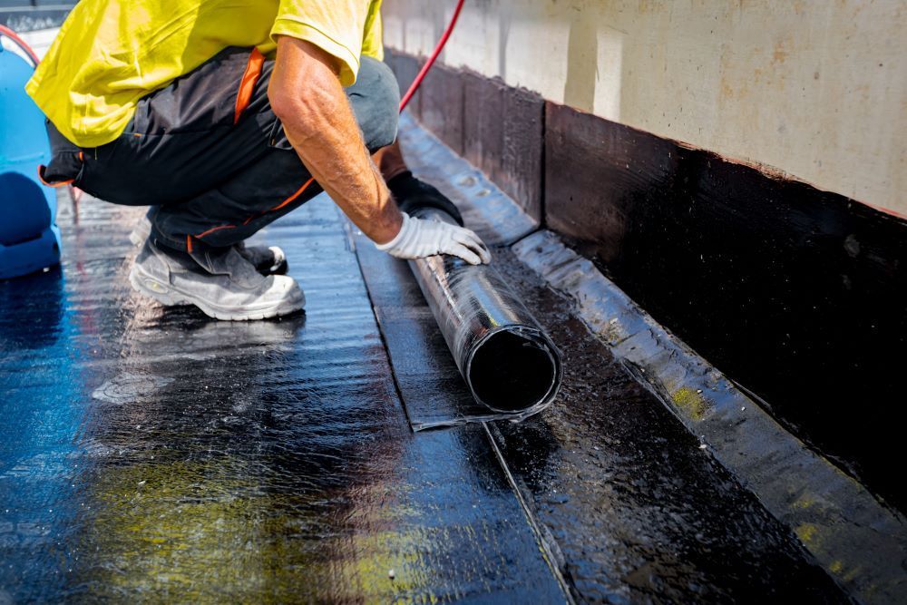 Installing A Sheet Of Membrane Waterproofing Over Concrete — Bananacoast Waterproofing in Korora, NSW