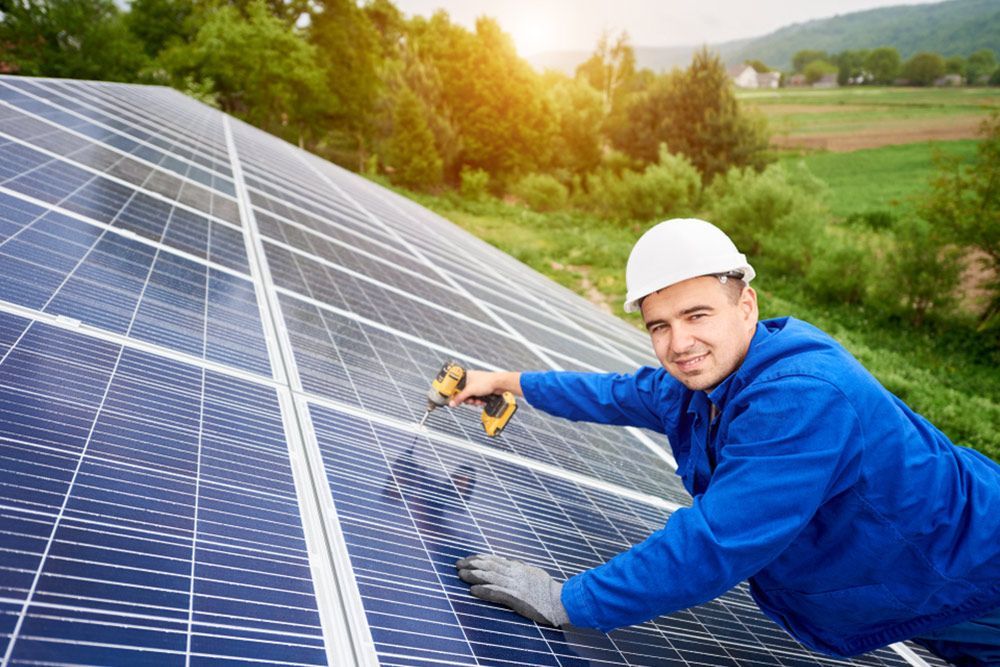 Man Installing Solar Panels — Electrical Contractor in Shoalhaven, NSW