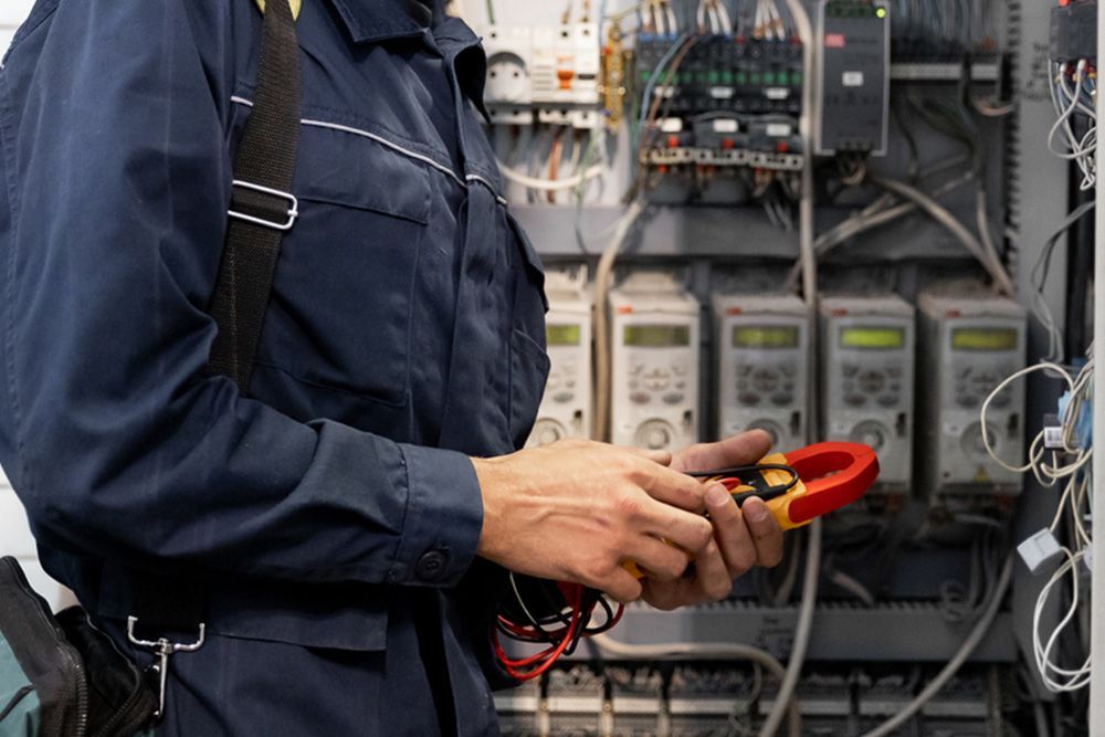 Electrician Holding Tools — Electrical Contractor in Shoalhaven, NSW