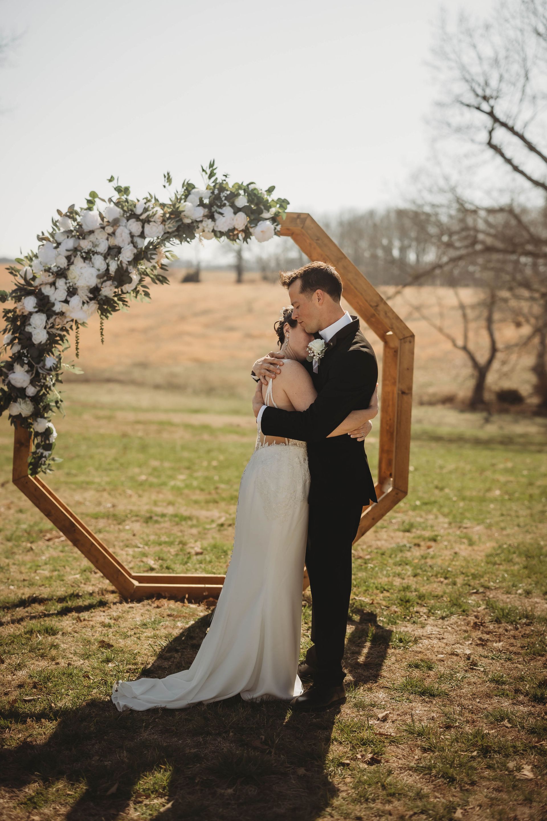 bride and groom hugging