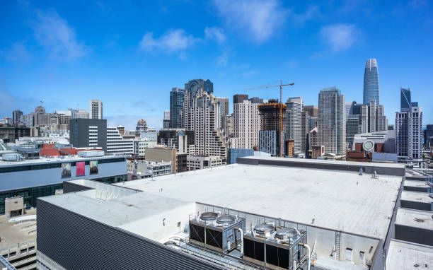 An aerial view of a city skyline from the roof of a building.
