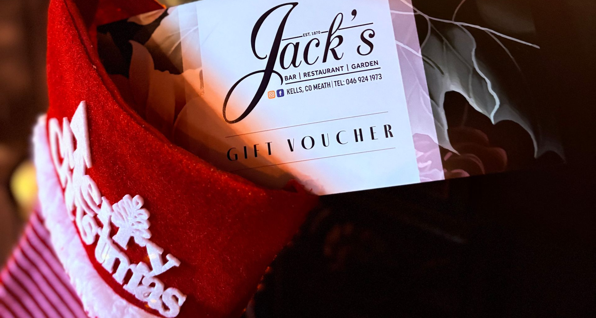 Red Christmas stocking with Jack's Restaurant gift voucher.