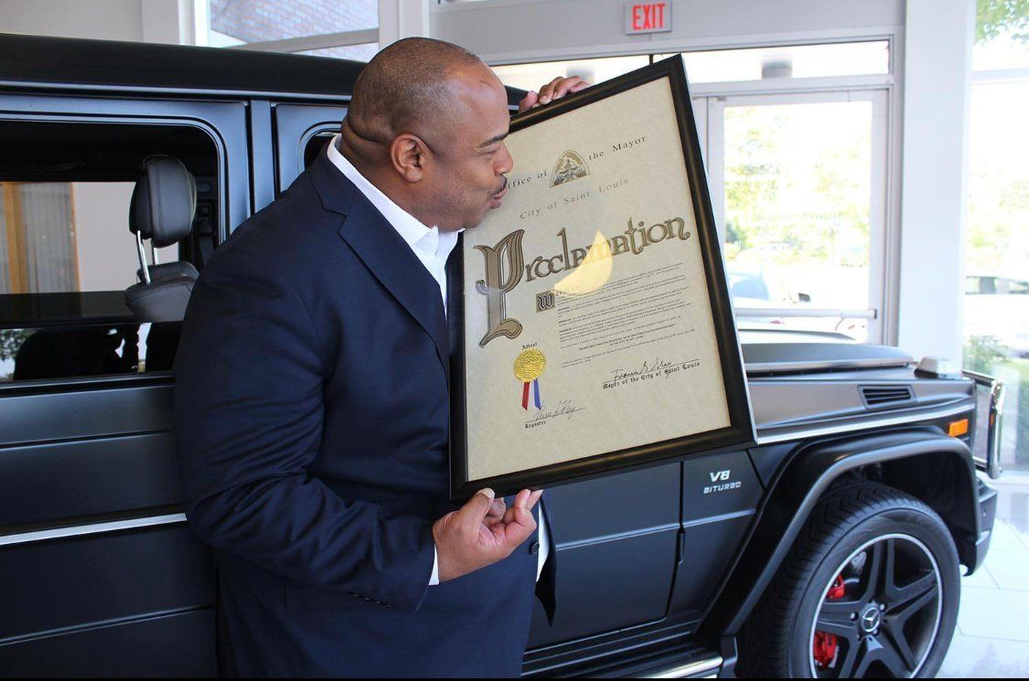 Rickey Whittington Kissing His Proclamation Certificate