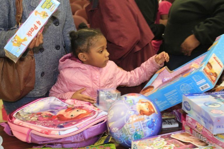 Little Girl Choosing a Toy