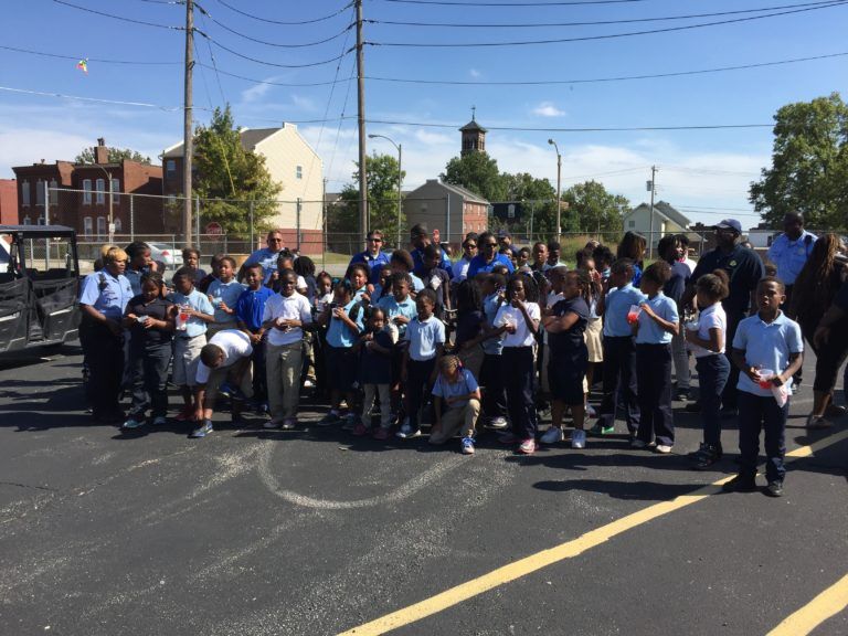 Children and Parents in Parking Area