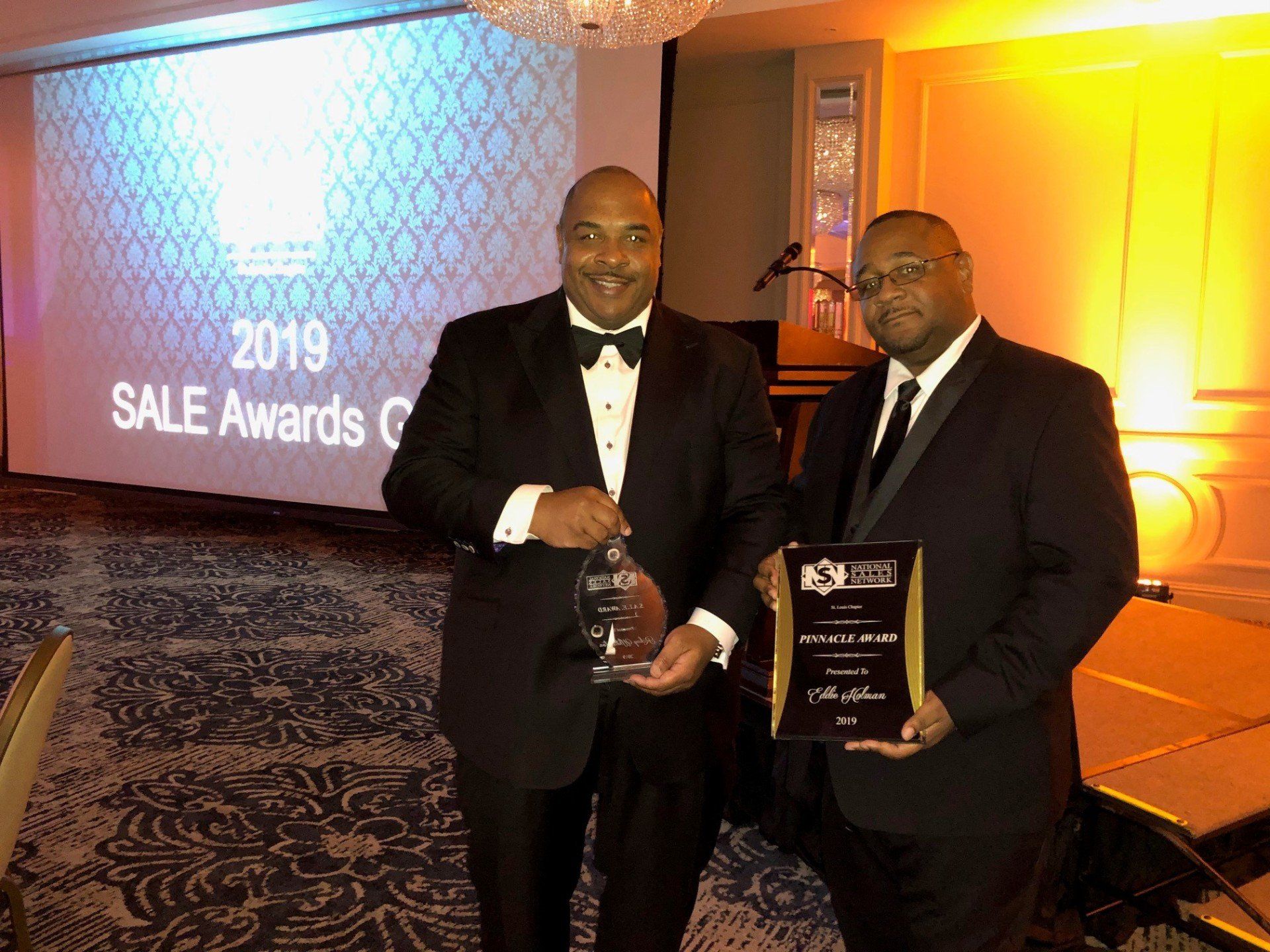 Rickey Whittington Holding His Sales Award