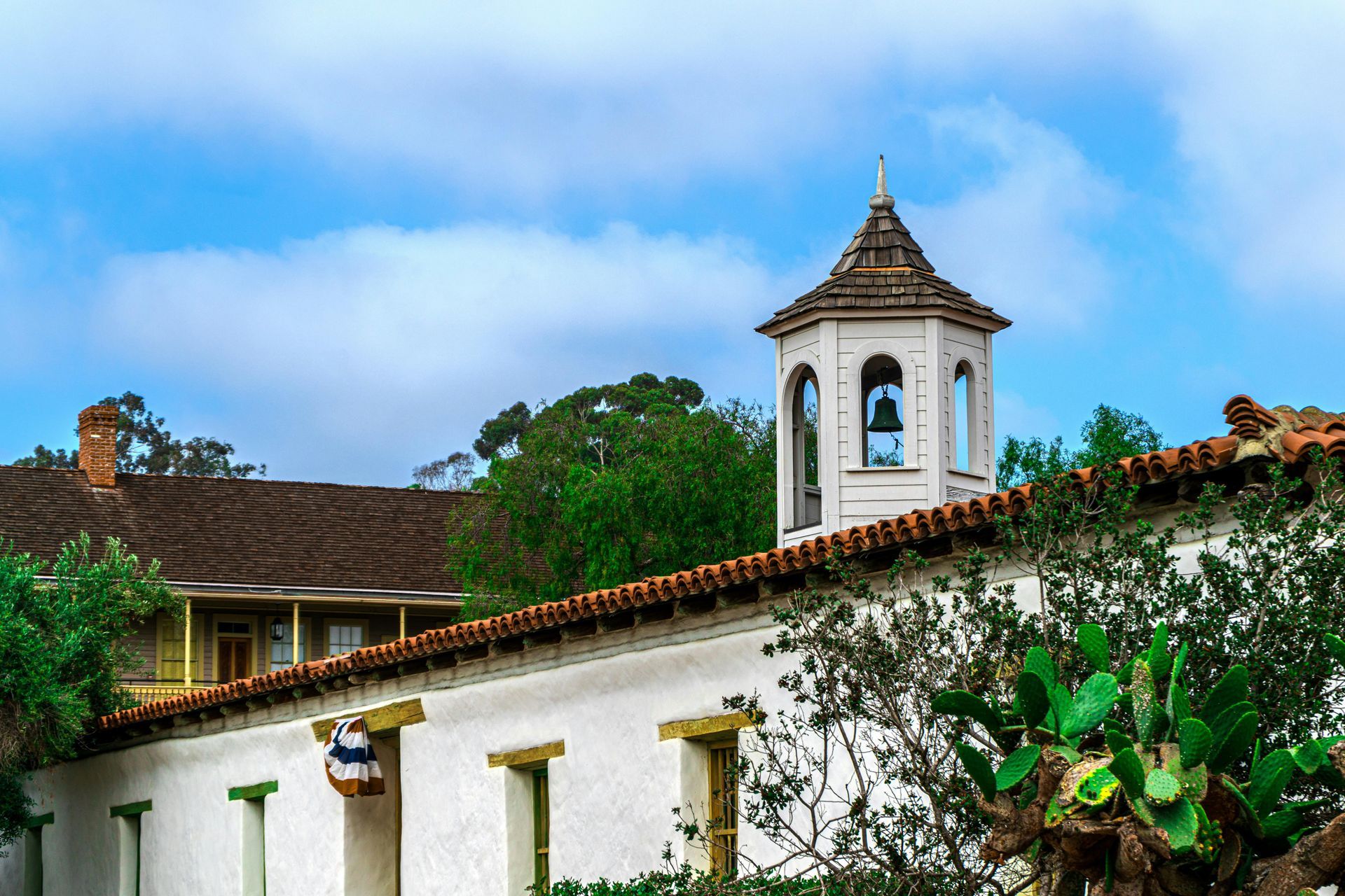 Spanish-style commercial building with white stucco walls, clay roof tile. Focused on commercial cleaning in Shawnee