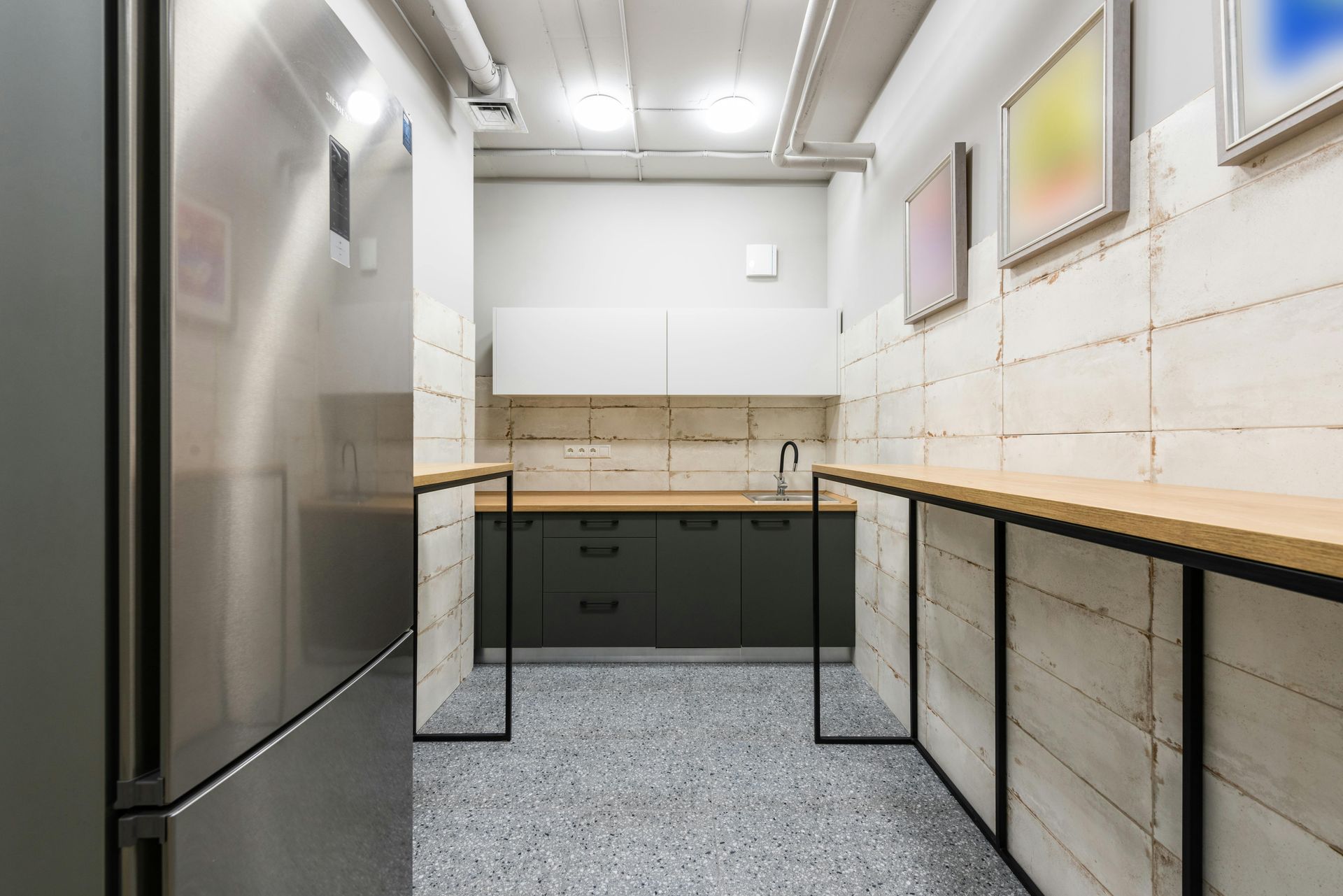 Office Kitchen space with completely cleaned spotless with pale colors