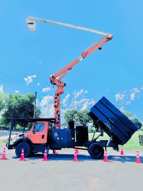 An orange truck with a crane on top of it