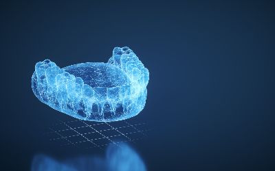 A 3d rendering of a dental mouth guard on a blue surface.