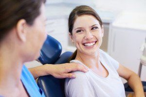 woman with dental assistant