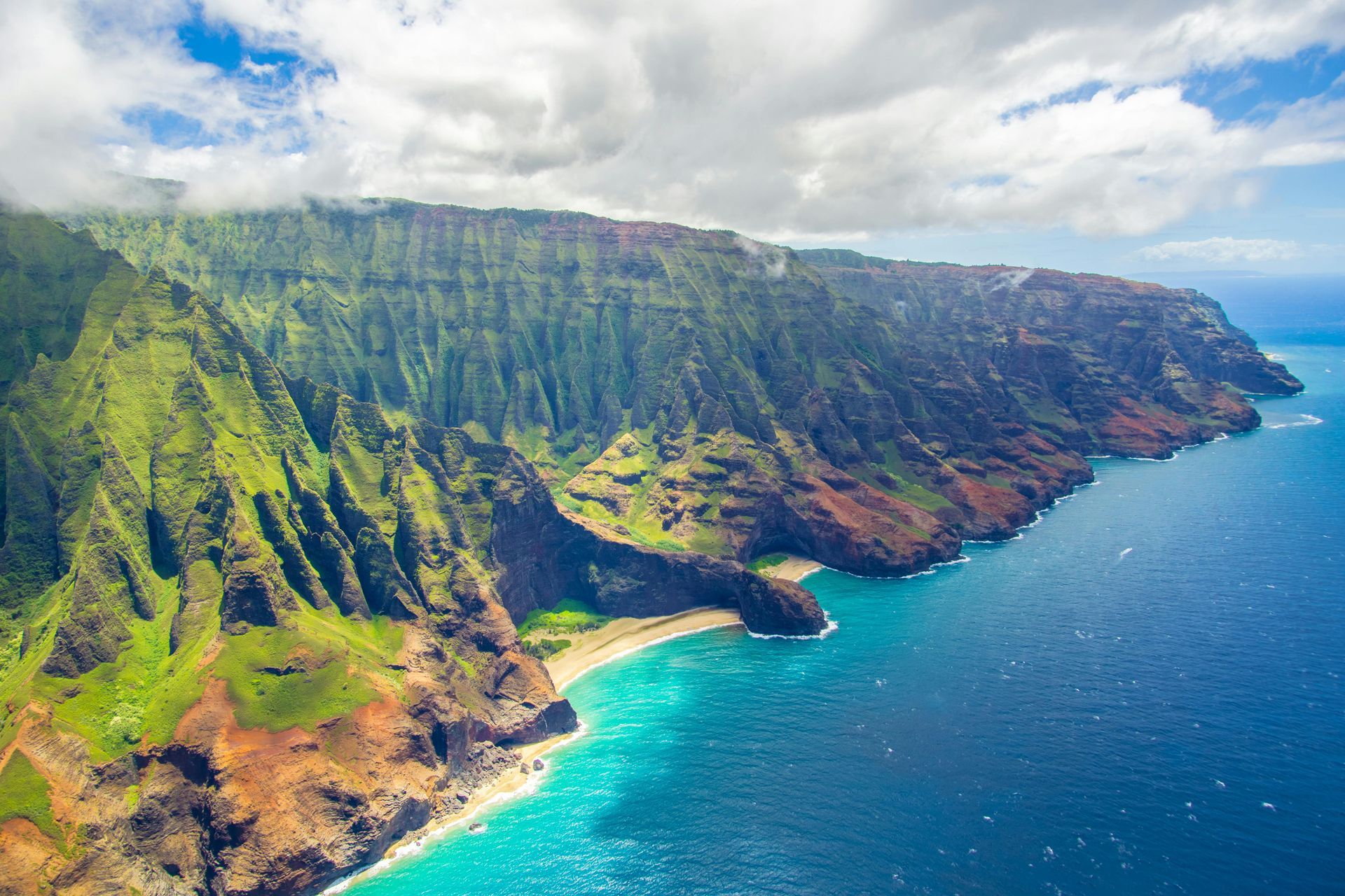 An aerial view of a cliff overlooking the ocean.