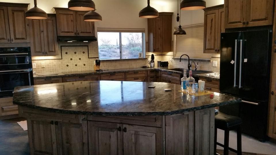 There is a large island in the middle of the kitchen.