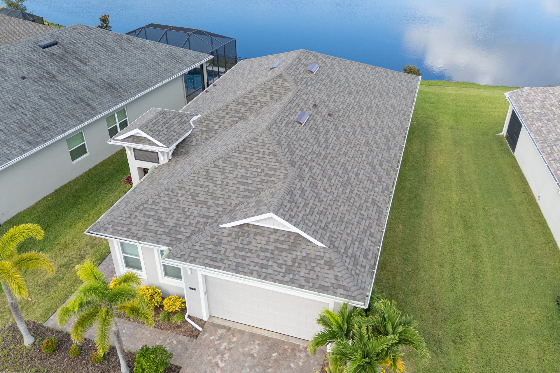New asphalt shingle roofing system on residential home Melbourne Brevard County Florida JT Roofing