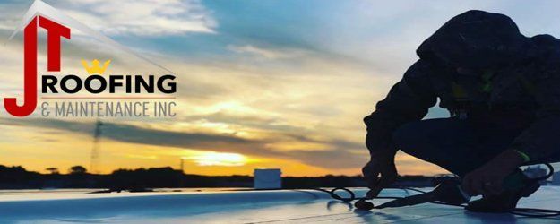 A silhouette of a worker on a flat roof at sunset, with the JT Roofing & Maintenance Inc. logo visible on the left.