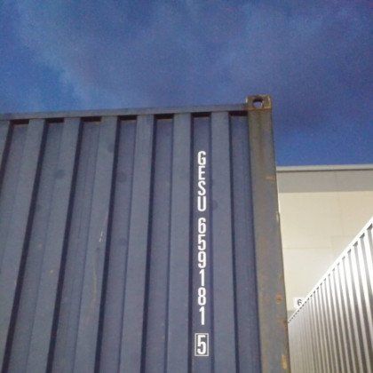 Blue shipping container with the letters G, E, S, U and the number 6591815 printed on it.
