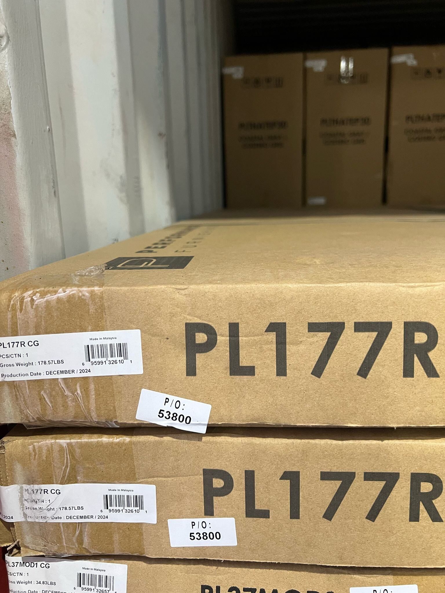 Stack of cardboard boxes labeled 