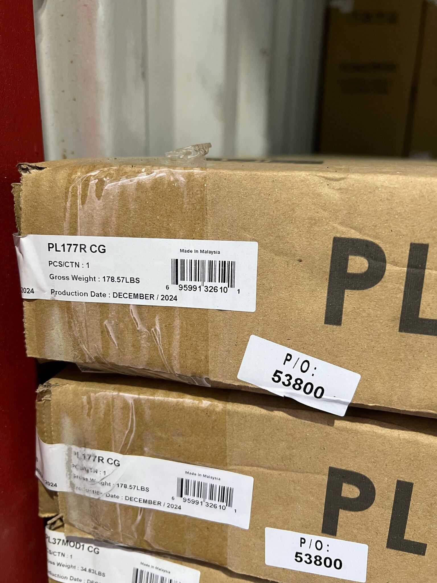 Boxes stacked; labels with barcodes and 