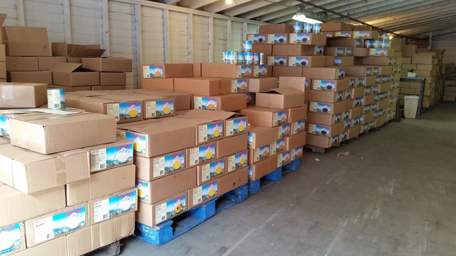 Warehouse storage: Pallets stacked with boxes of food.
