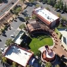 An aerial view of a city with a lot of buildings and trees.