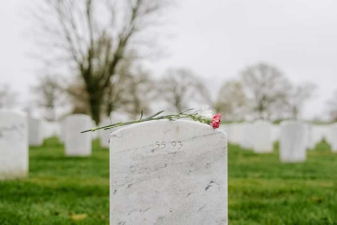 Flower on gravestone in cemetery, funeral home and cremations Pharr, TX