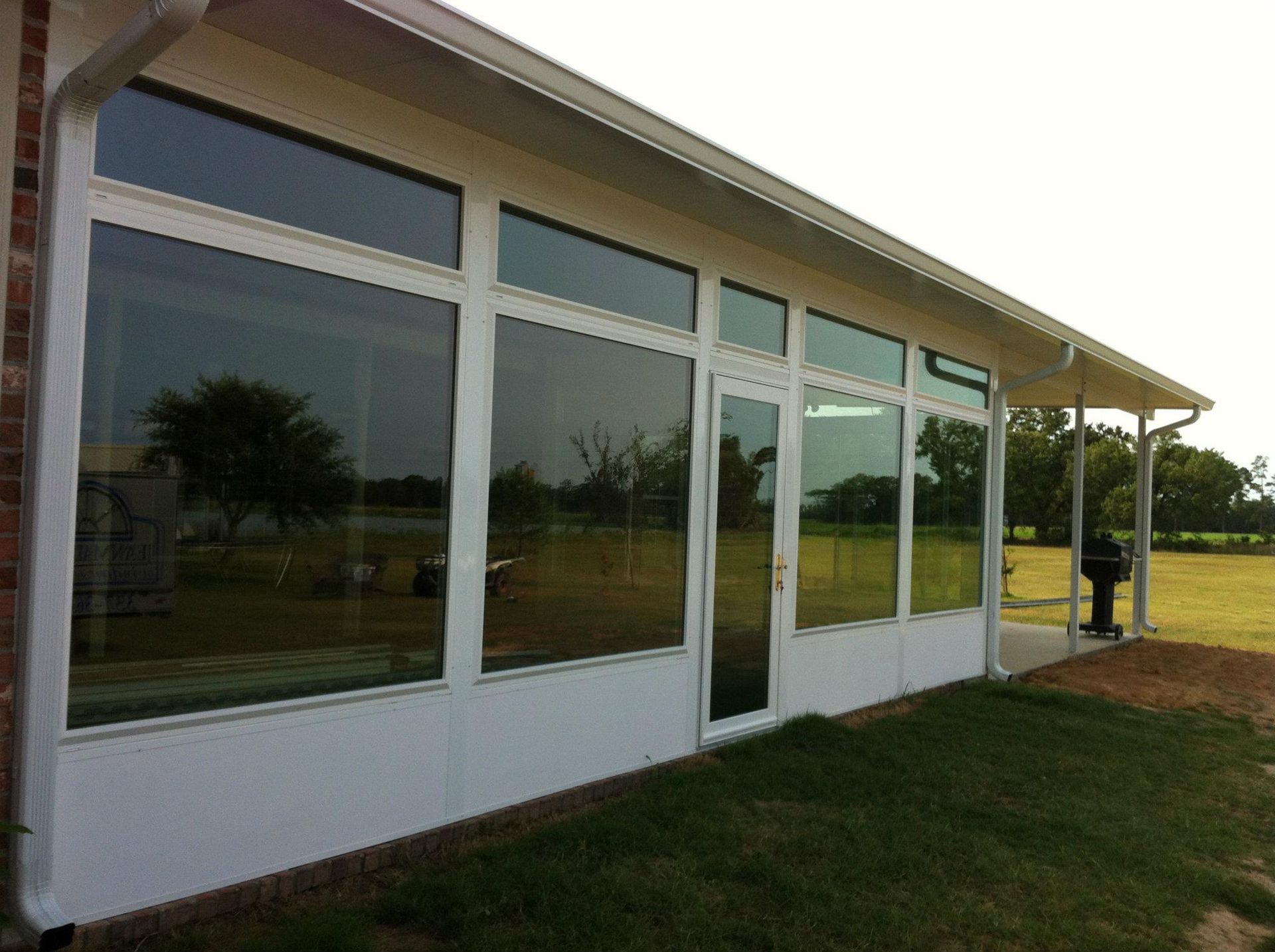 A white house with a lot of windows and doors