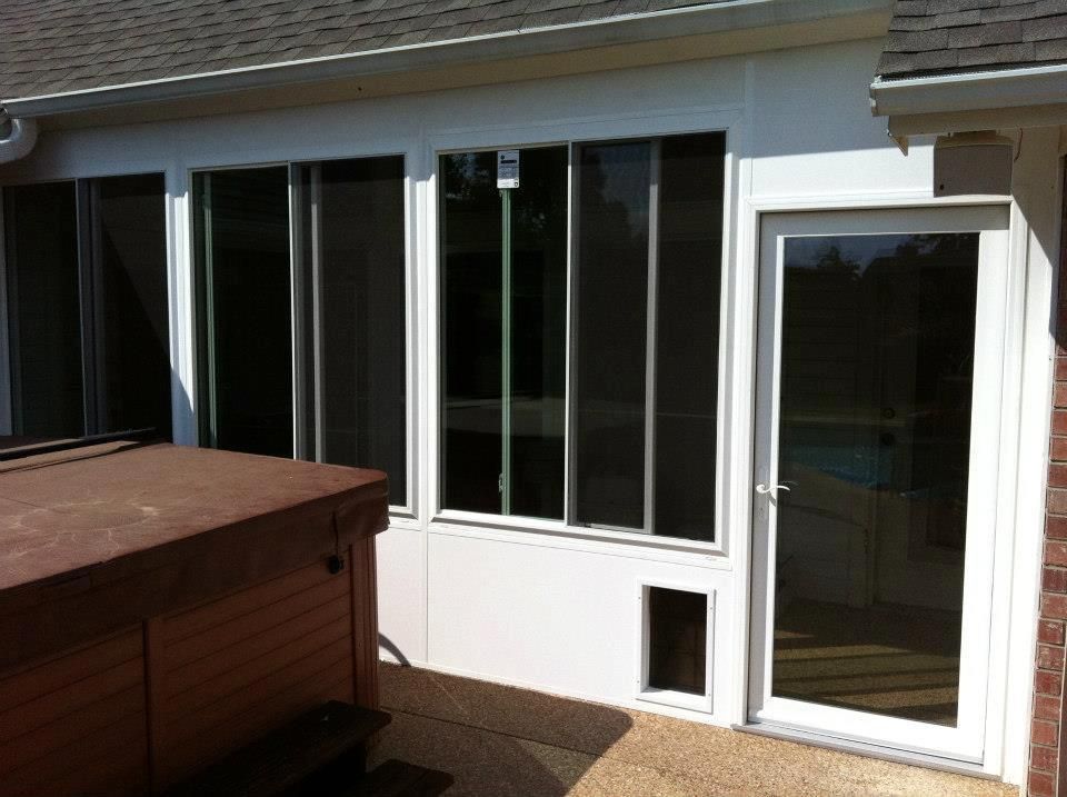 A house with a hot tub and a screened in porch