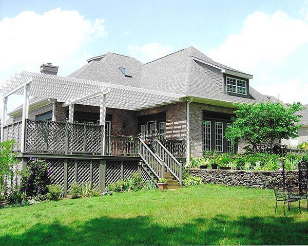 A large house with a large lawn in front of it