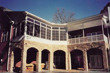 A large house with a lot of windows and arches