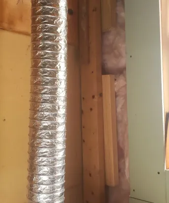 Batt insulation tucked around window frame