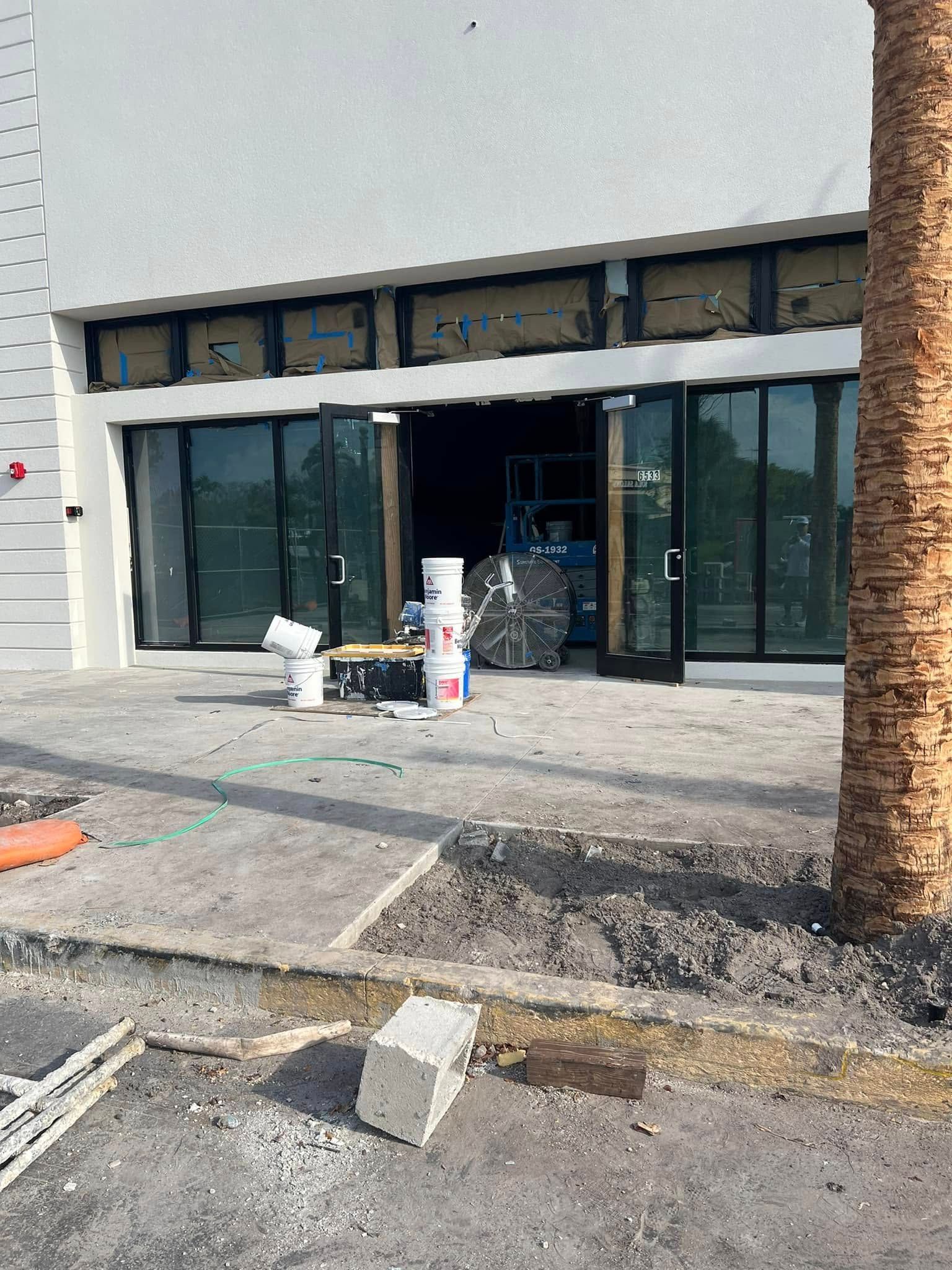 A building with a lot of windows is being remodeled.