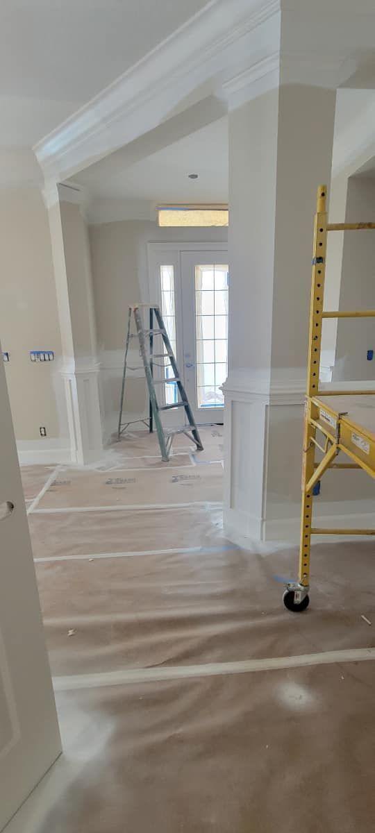 A room with a ladder and a scaffolding in it.